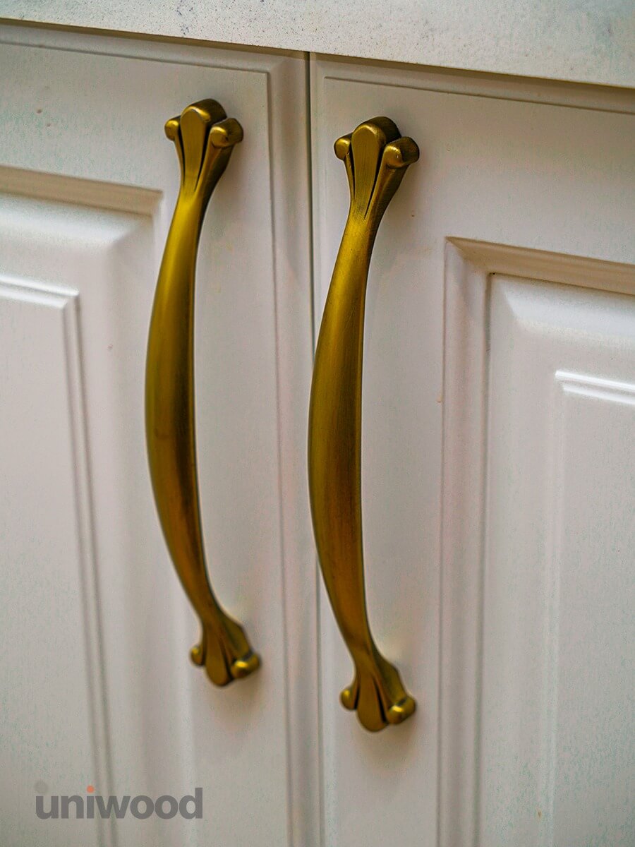 Elegant Details: Brass Handles on Classic Wooden Shutters
